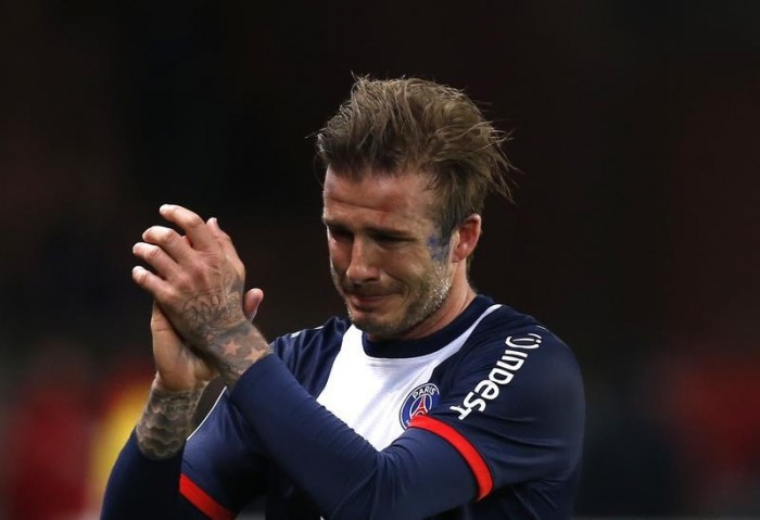Paris Saint-Germain's David Beckham breaks down in tears as he leaves the pitch after being substituted in the 81st minute during his team's French Ligue 1 soccer match against Brest at the Parc des Princes stadium in Paris May 18, 2013. REUTERS/Gonzalo Fuentes (FRANCE - Tags: SPORT SOCCER TPX IMAGES OF THE DAY) - RTXZS5M